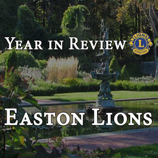 Year in review letter for the Easton Lions header with Queset Gardens image in background.