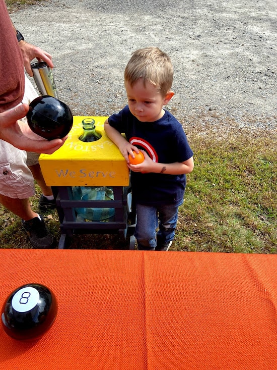 Child looking at magic eight ball
