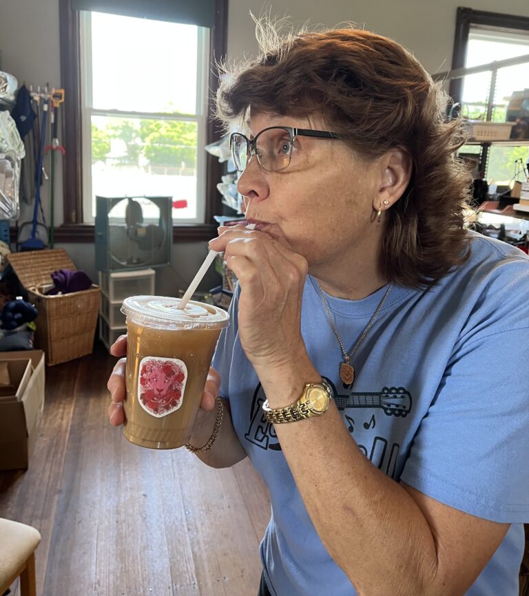 IPP Lori Laver Maver sipping a pink Parker Lion at the Thrift
