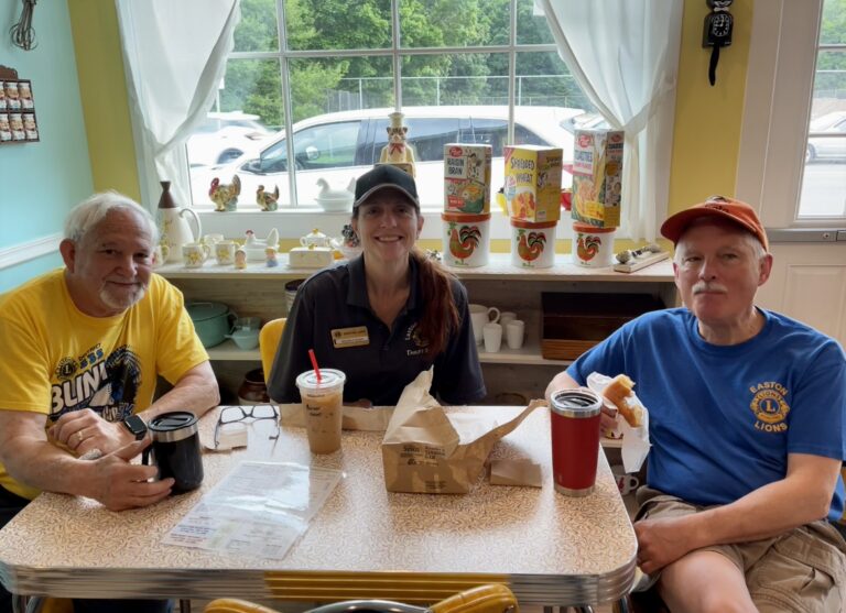 Ron, Michelle & Jon take a break between helping We Do Care and at the Thrift Store with Parker Lions (and donuts!) at the Beanery